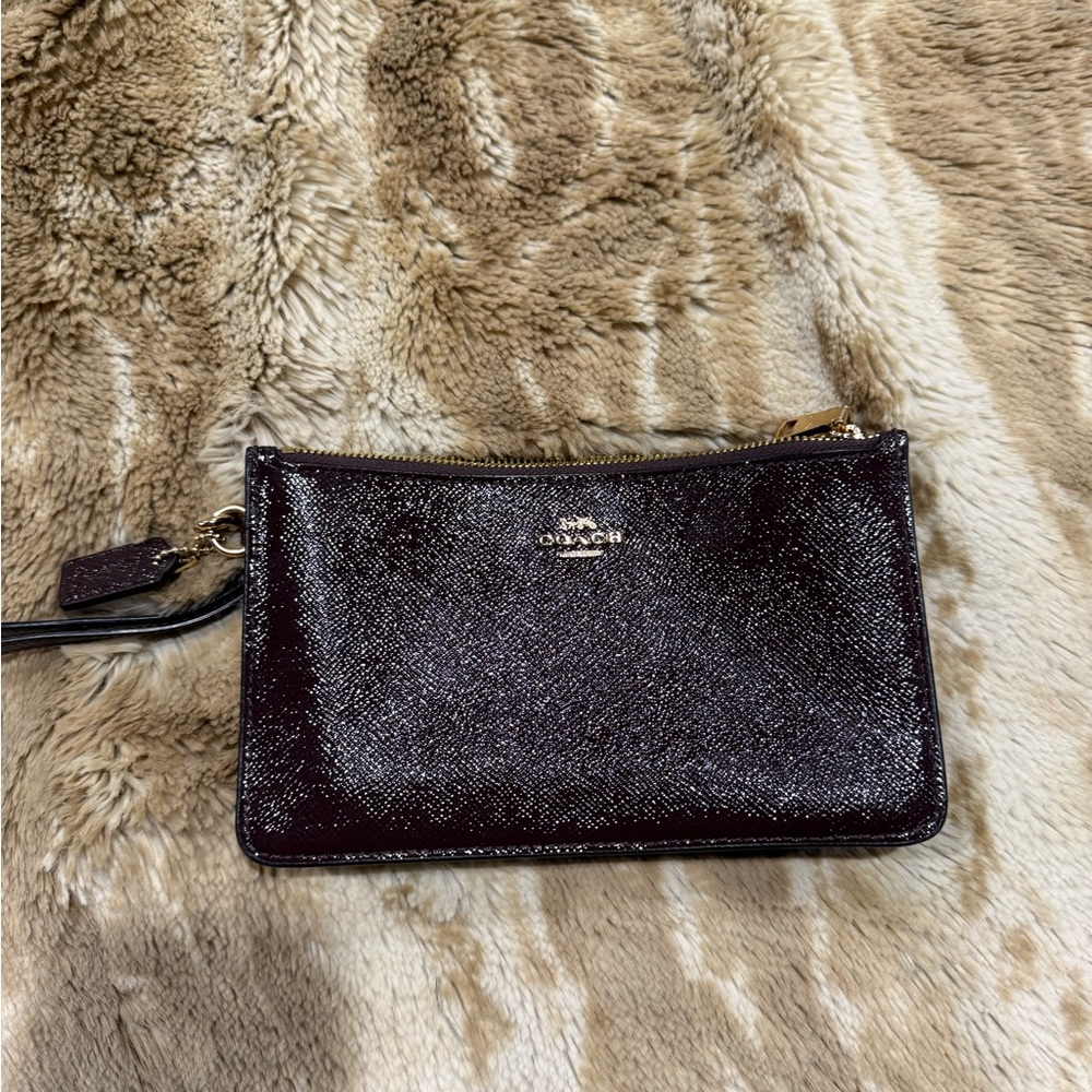 Coach Shimmery Plum Patent Wristlet with Gold Details